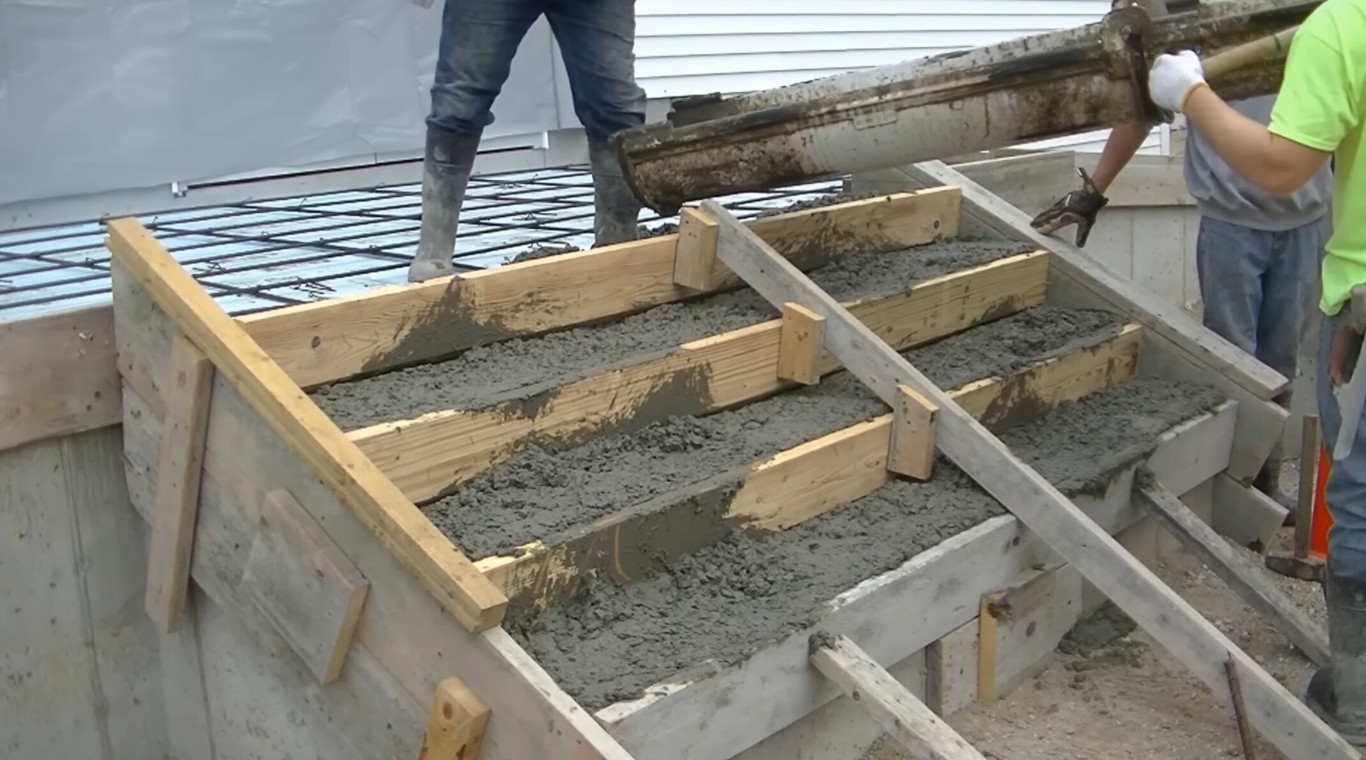 Concrete steps being poured with proper forming and reinforcement in Champaign, IL