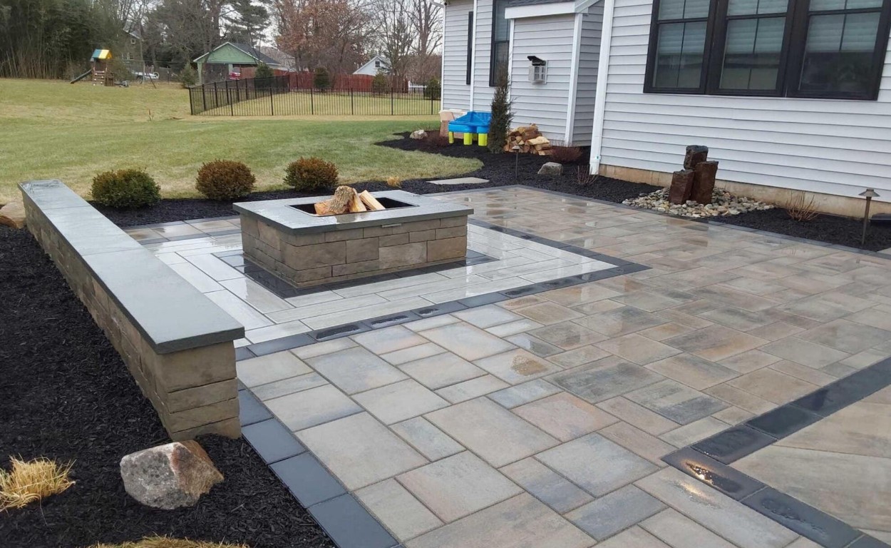 Beautifully finished concrete patio with fire pit showcasing quality craftsmanship in Champaign, IL